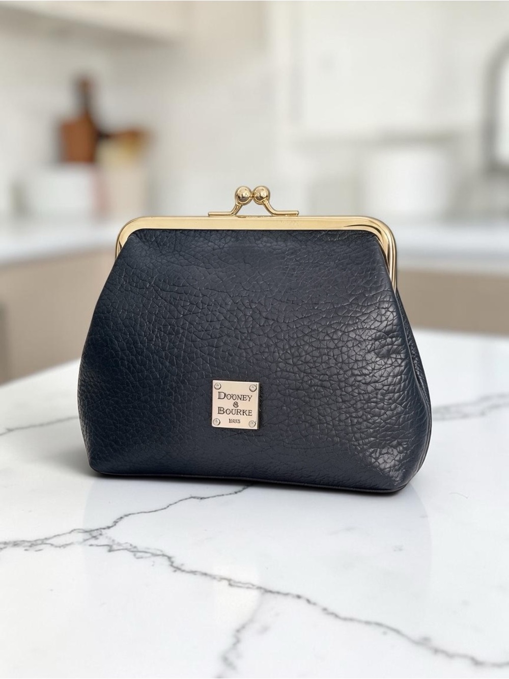 Dooney & Bourke
Black Leather Kiss-Lock Coin
Purse with Gold Hardware
Excellent